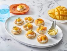 Smoked salmon and mango blinis